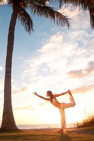 Beach yoga classes with YOGiiZA in Miami.