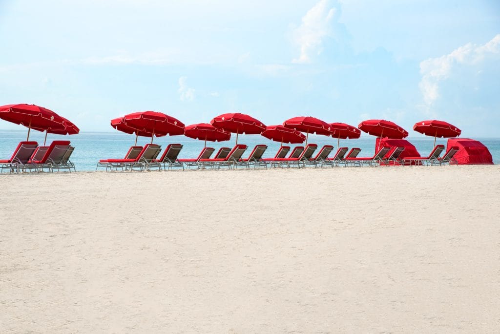 Acqualina's Beach with Red Beach Chairs