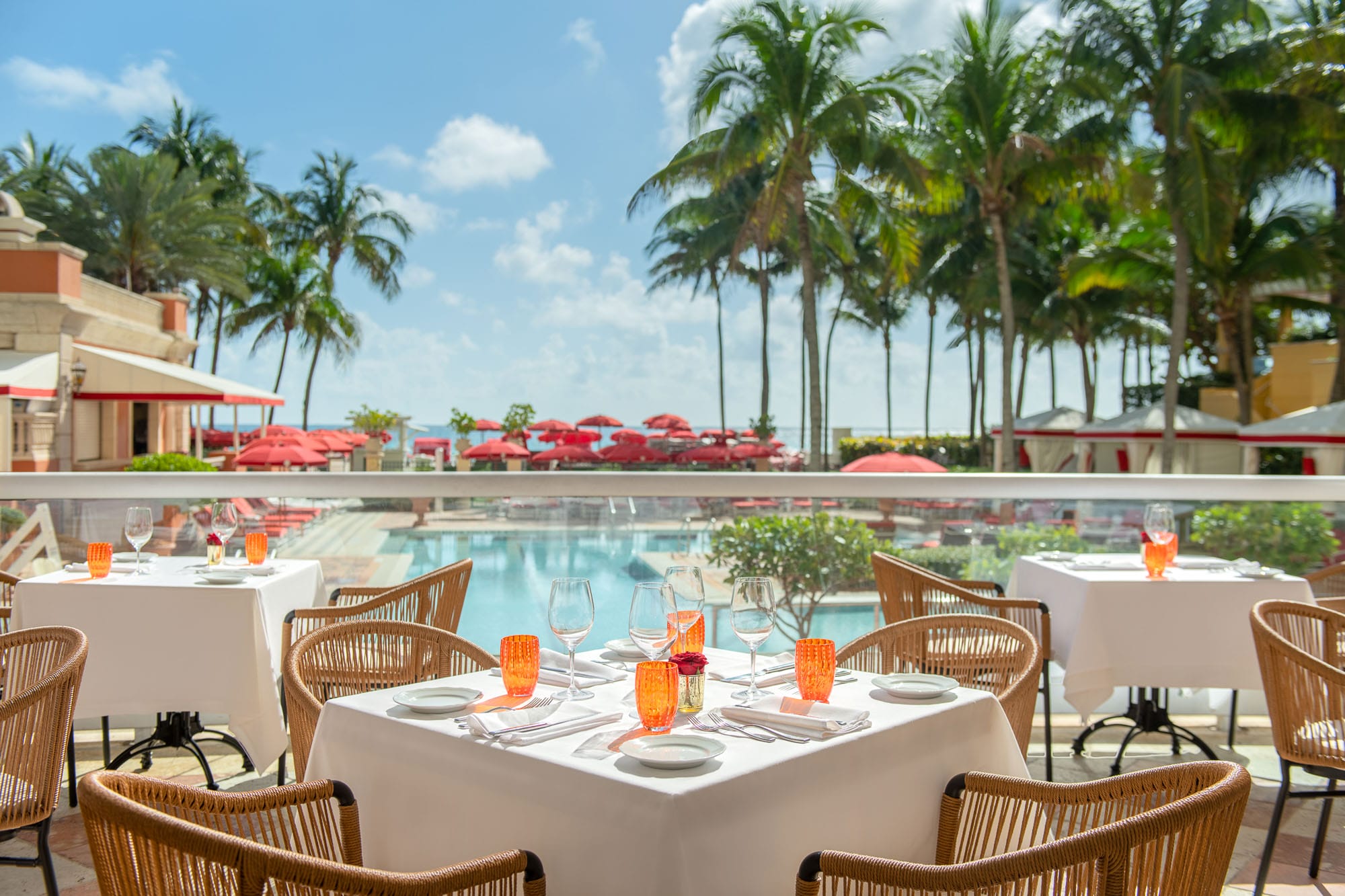 Table at Il Mulino Terrace with a view of the pool and beach
