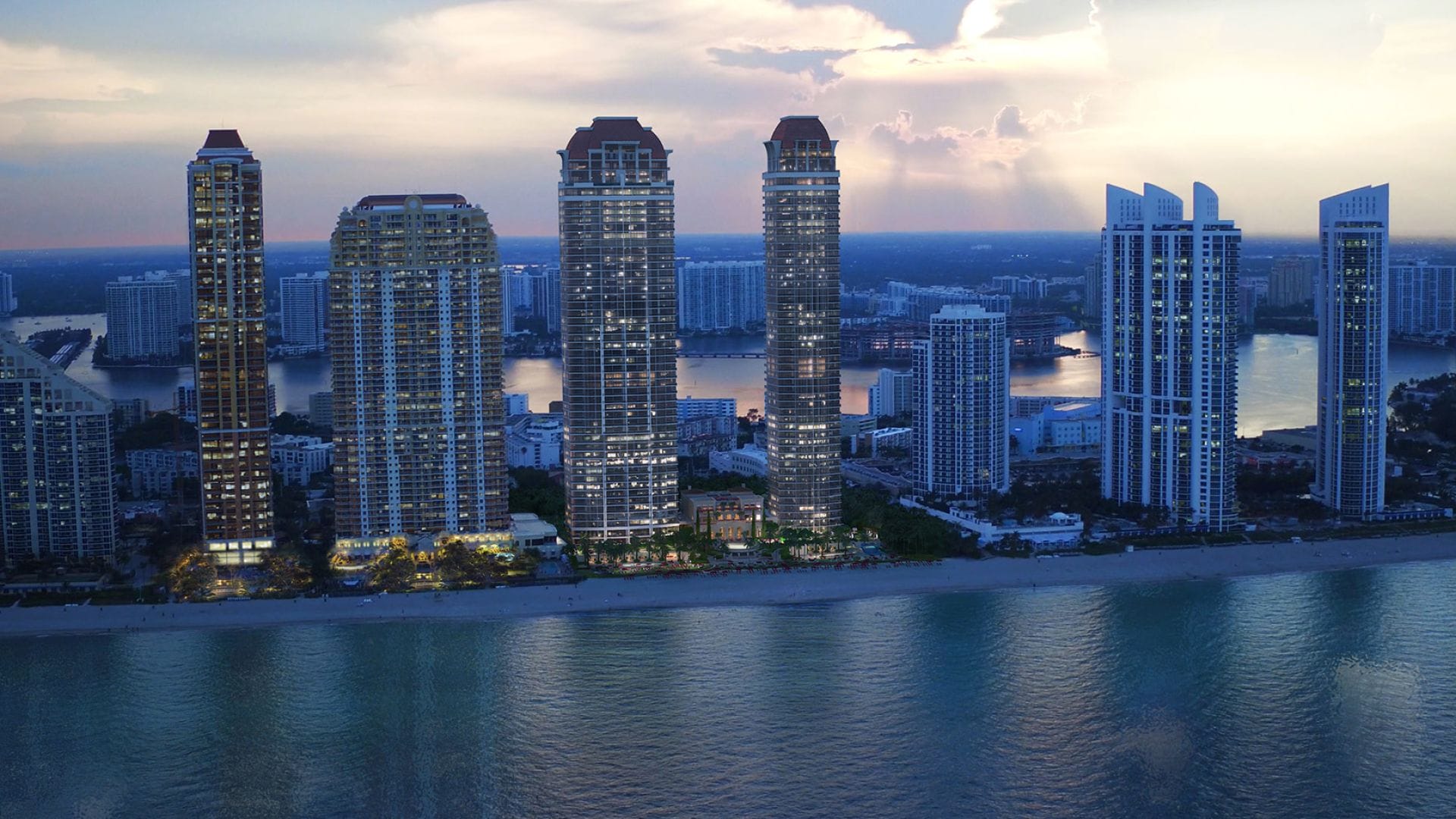 luxury beachfront city skyline at sunset with high-rise towers and ocean view